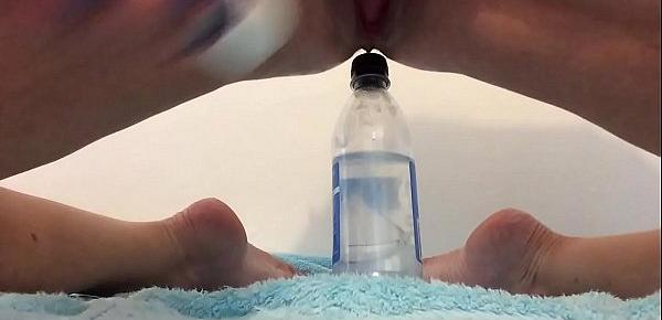  Squirting over a bottle of water